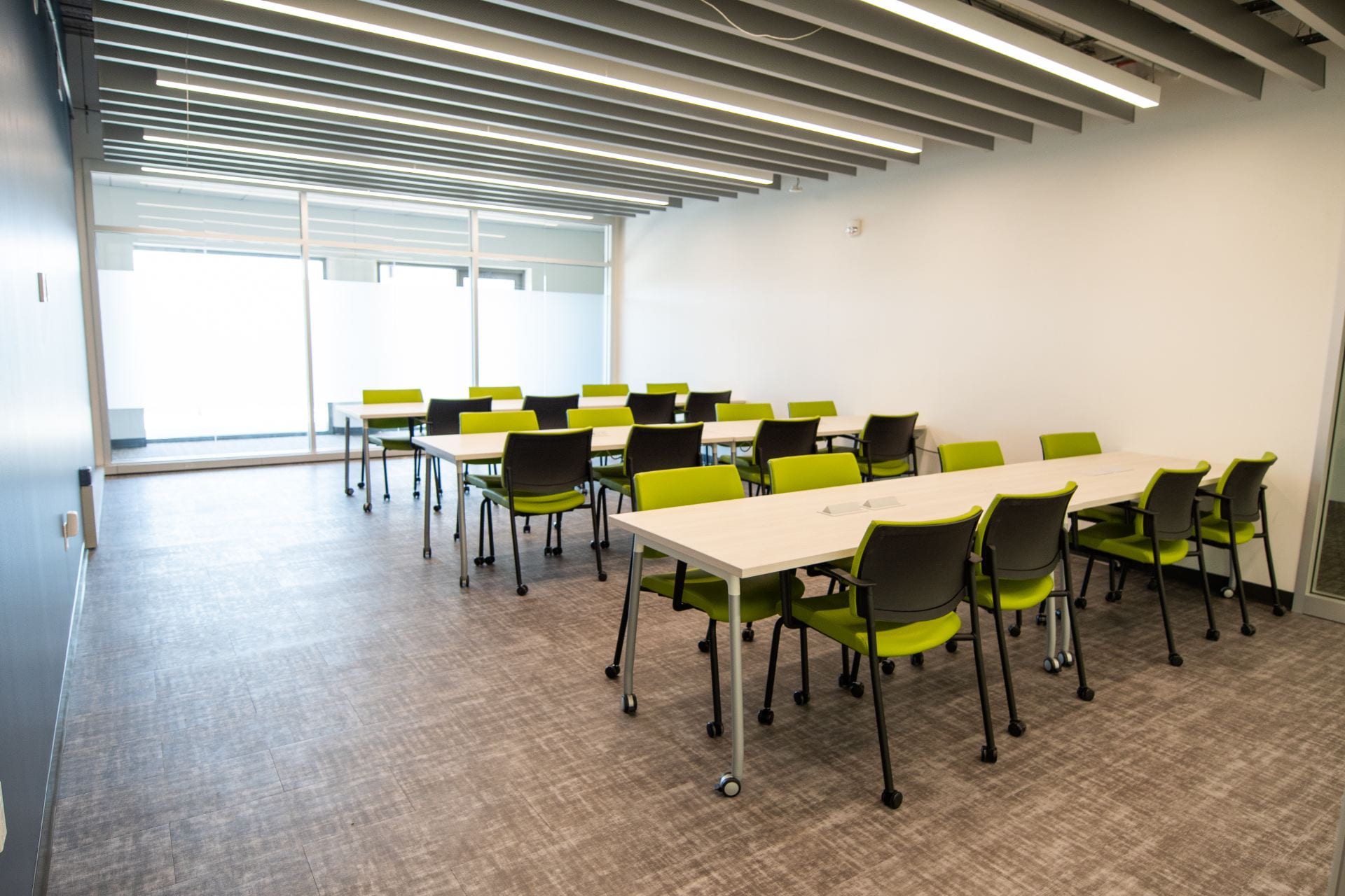 Set of tables and chairs in a room at the Student Excellence Center