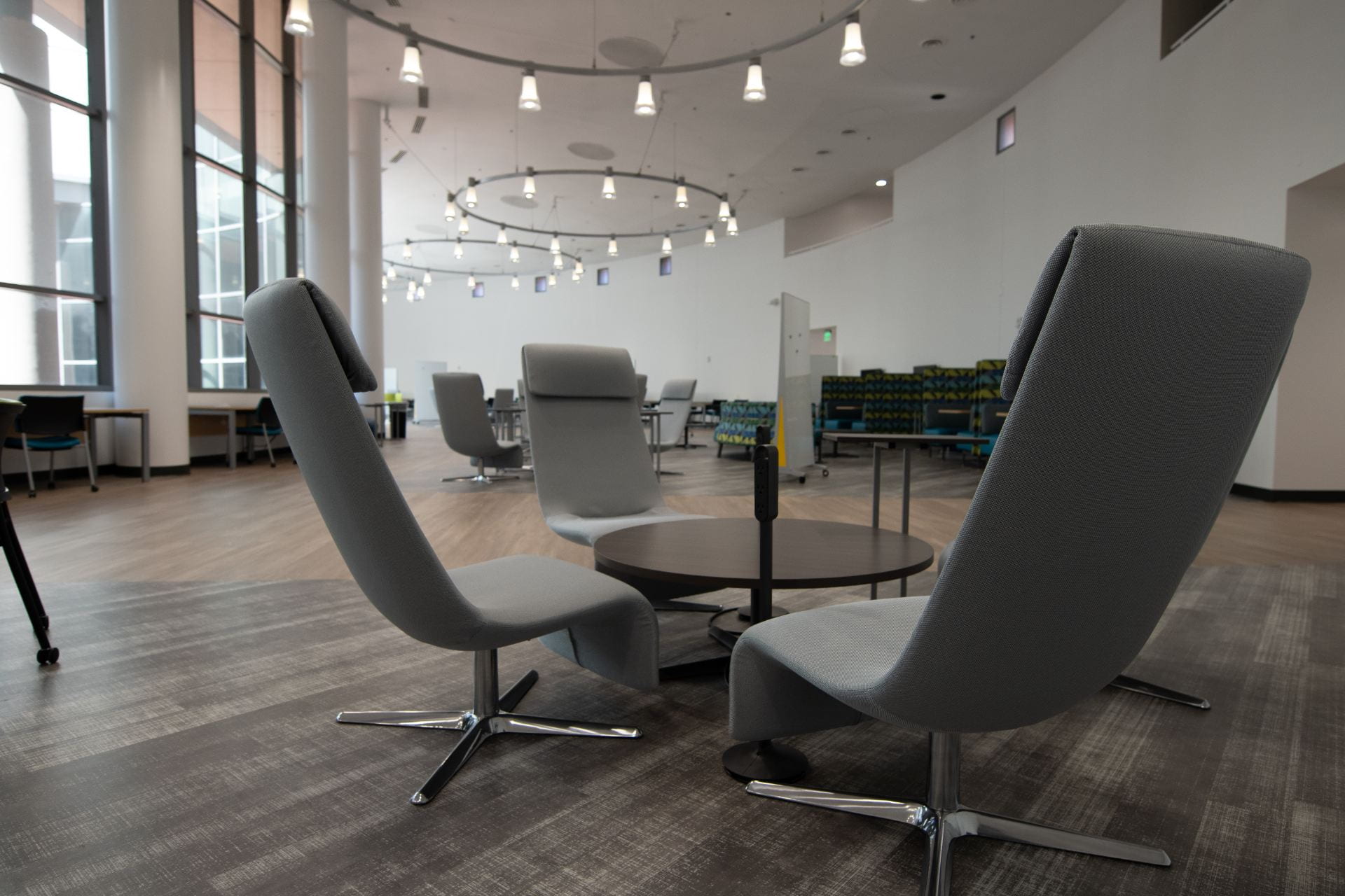 Lounge in the Student Excellence Center with an assortment of chairs & tables